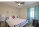 Comfortable bedroom with a ceiling fan, carpet flooring, and bright natural light at 1761 N Hester Trl, Casa Grande, AZ 85122