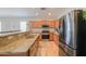 Kitchen with granite countertops, stainless steel appliances, and ample cabinet space at 1761 N Hester Trl, Casa Grande, AZ 85122