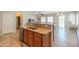 Open kitchen featuring granite countertops, stainless steel appliances, and seamless flow to the living area at 1761 N Hester Trl, Casa Grande, AZ 85122