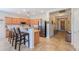Well-lit kitchen with granite countertops, stainless steel appliances, and wooden cabinetry at 1761 N Hester Trl, Casa Grande, AZ 85122