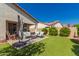 Spacious backyard showcasing a patio area, lush lawn, and well-maintained landscaping at 17825 W Lincoln St, Goodyear, AZ 85338