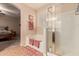 Bright bathroom featuring a soaking tub and separate glass-enclosed shower at 17825 W Lincoln St, Goodyear, AZ 85338