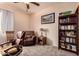Cozy bedroom featuring plush carpet, comfortable seating, and ample natural light at 17825 W Lincoln St, Goodyear, AZ 85338