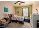 Cheerful bedroom with a fun decor, and good natural light at 17825 W Lincoln St, Goodyear, AZ 85338