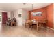 Cozy dining room featuring wood table and chairs, neutral walls, and natural lighting at 17825 W Lincoln St, Goodyear, AZ 85338