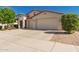 Inviting single-story home with a three-car garage, desert landscaping, and a charming entryway at 17825 W Lincoln St, Goodyear, AZ 85338