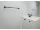 Bathroom featuring a vanity with white cabinets, a dark faucet, and a towel rack at 1847 E Kirkland Ln # C, Tempe, AZ 85281