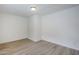 Bedroom featuring wood-look flooring and neutral paint at 1847 E Kirkland Ln # C, Tempe, AZ 85281