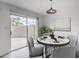 Charming dining area with sliding glass doors to the backyard offers ample natural light at 1847 E Kirkland Ln # C, Tempe, AZ 85281