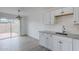 Kitchen with granite countertops and wood-look flooring adjacent to an outdoor access at 1847 E Kirkland Ln # C, Tempe, AZ 85281