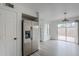 Kitchen area with stainless steel refrigerator and an adjacent view of the backyard at 1847 E Kirkland Ln # C, Tempe, AZ 85281