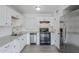 A kitchen with stainless steel appliances, granite countertops, and white cabinets at 1847 E Kirkland Ln # C, Tempe, AZ 85281