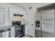View of stainless steel refrigerator and black range in the kitchen area at 1847 E Kirkland Ln # C, Tempe, AZ 85281