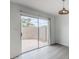 Living room area with sliding glass door leading to an enclosed backyard patio at 1847 E Kirkland Ln # C, Tempe, AZ 85281