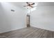 Bright living room featuring a vaulted ceiling with ceiling fan and wood-look vinyl floors at 1847 E Kirkland Ln # C, Tempe, AZ 85281
