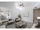 Bright living room with vaulted ceilings, ceiling fan, and neutral decor provides a welcoming atmosphere at 1847 E Kirkland Ln # C, Tempe, AZ 85281