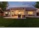 Spacious backyard with covered patio including a grill and seating, perfect for outdoor dining and relaxation at 2045 E San Carlos Pl, Chandler, AZ 85249