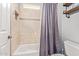 Bathroom featuring a tiled shower and bath, shelving, and convenient toilet at 2045 E San Carlos Pl, Chandler, AZ 85249