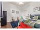 Bedroom with wood floors, neutral walls, a colorful quilt, and an accent rug at 2045 E San Carlos Pl, Chandler, AZ 85249