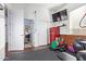 Flex room featuring gym equipment, a mini fridge, and access to the house at 2045 E San Carlos Pl, Chandler, AZ 85249