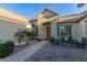 Inviting home featuring a cozy front patio with outdoor seating and a charming fountain, all on a bright sunny day at 2045 E San Carlos Pl, Chandler, AZ 85249