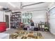 Garage with a colorful rug, overhead storage, a work bench, and ample lighting at 2045 E San Carlos Pl, Chandler, AZ 85249