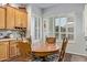 Inviting breakfast nook area with kitchen views featuring natural light and wood cabinets at 2045 E San Carlos Pl, Chandler, AZ 85249