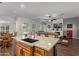 Kitchen island view showcasing the open floor plan and adjacent living area at 2045 E San Carlos Pl, Chandler, AZ 85249