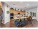 Bright, open kitchen with island seating, stainless appliances, and hardwood floors at 2045 E San Carlos Pl, Chandler, AZ 85249