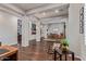 Expansive living room with dark wood floors seamlessly connects to the dining area at 2045 E San Carlos Pl, Chandler, AZ 85249