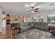 Open-concept living area featuring a large sectional sofa and views into the kitchen at 2045 E San Carlos Pl, Chandler, AZ 85249
