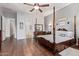 Spacious primary bedroom featuring hardwood floors, ceiling fan, and natural lighting at 2045 E San Carlos Pl, Chandler, AZ 85249