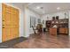 Inviting front entry leads to a bright office space with hardwood floors and custom wood desk at 2045 E San Carlos Pl, Chandler, AZ 85249