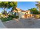 Home featuring a landscaped side yard with gravel groundcover, green bushes, and decorative brick wall at 2045 E San Carlos Pl, Chandler, AZ 85249