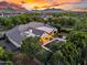 Outdoor paradise featuring an inviting pool, spa, covered patio, and verdant landscaping at 20644 E Sunrise Ct, Queen Creek, AZ 85142
