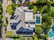 Aerial view of a home featuring a sparkling pool, patio area and lush green landscaping at 20644 E Sunrise Ct, Queen Creek, AZ 85142