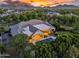 Aerial shot of a home with a pool, outdoor kitchen, covered living areas, and a beautiful lawn at 20644 E Sunrise Ct, Queen Creek, AZ 85142