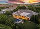 Lush backyard showcasing an inviting pool, covered outdoor living areas, and mature trees at 20644 E Sunrise Ct, Queen Creek, AZ 85142