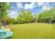 Lush backyard with well-maintained artificial turf and a volleyball net, perfect for outdoor activities at 20644 E Sunrise Ct, Queen Creek, AZ 85142
