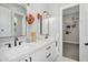 Bright bathroom with double vanities, stylish fixtures, and decorative hot air balloons at 20644 E Sunrise Ct, Queen Creek, AZ 85142