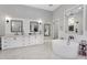 Luxurious bathroom with a freestanding tub and a frameless glass shower at 20644 E Sunrise Ct, Queen Creek, AZ 85142
