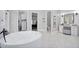 Spacious bathroom with a modern freestanding tub and access to closet and toilet at 20644 E Sunrise Ct, Queen Creek, AZ 85142