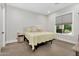 Serene bedroom featuring a comfortable bed and a large window with natural light at 20644 E Sunrise Ct, Queen Creek, AZ 85142