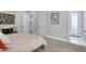 Cozy bedroom with carpet, neutral walls, and multiple doors at 20644 E Sunrise Ct, Queen Creek, AZ 85142