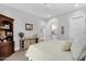 Inviting bedroom with a decorative dresser, artwork, and a cozy bed at 20644 E Sunrise Ct, Queen Creek, AZ 85142