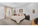 Comfortable bedroom with decorative curtains, neutral palette, and matching nightstands at 20644 E Sunrise Ct, Queen Creek, AZ 85142