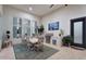 Covered dining area with an outdoor grill, ample seating, and views of the beautifully landscaped backyard, for entertaining at 20644 E Sunrise Ct, Queen Creek, AZ 85142