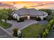 Expansive home featuring a three-car garage, desert landscaping, and a circular driveway at 20644 E Sunrise Ct, Queen Creek, AZ 85142
