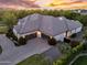 Elegant estate showcasing a three-car garage and professionally landscaped grounds at 20644 E Sunrise Ct, Queen Creek, AZ 85142