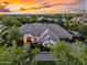 Beautiful, well-maintained home showcasing manicured landscaping and a charming covered entry at 20644 E Sunrise Ct, Queen Creek, AZ 85142